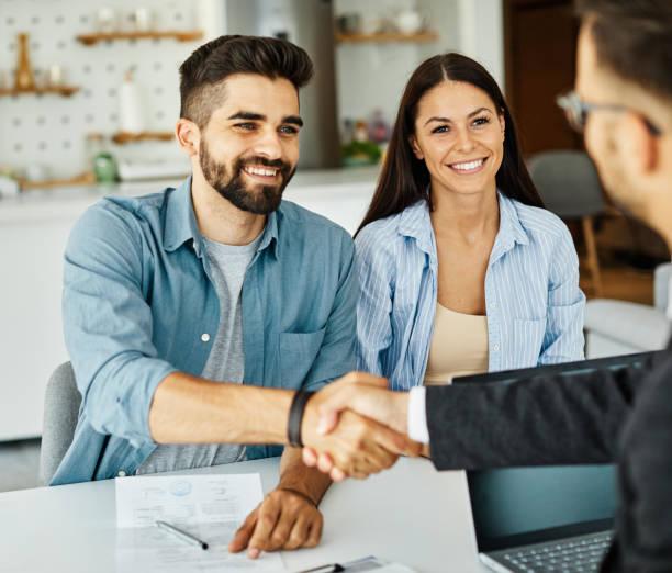 First-time homebuyers discussing FHA vs. Conventional mortgage options